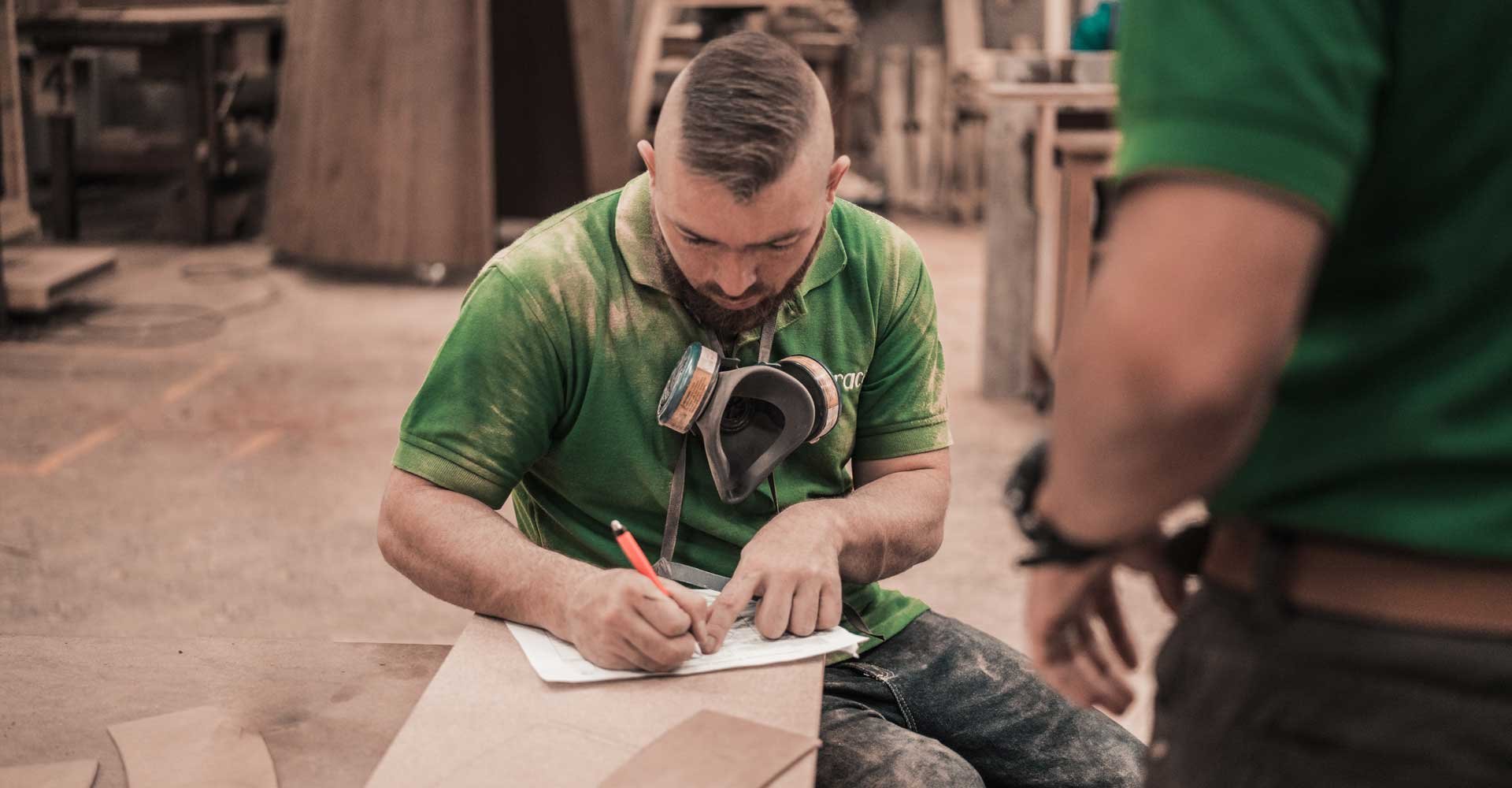 man working at a manufacturing plant that has decreased employee turnover