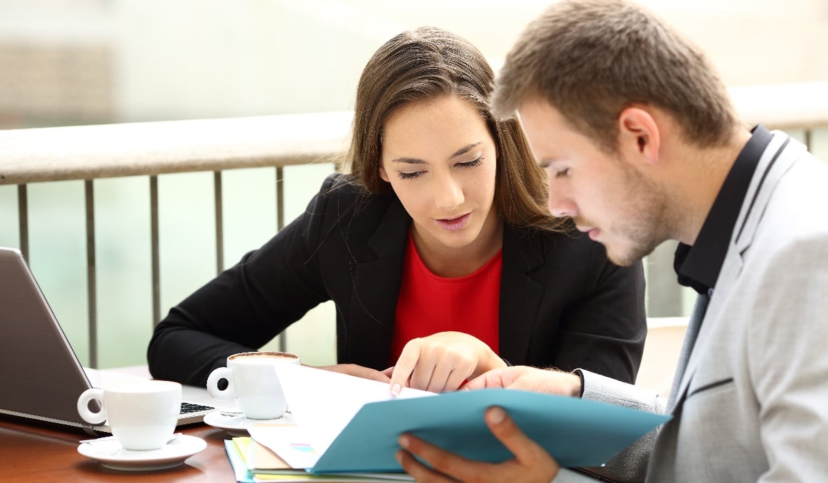 Colleagues reviewing files